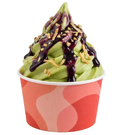 Pistachio soft serve ice cream with berry sauce and nut toppings